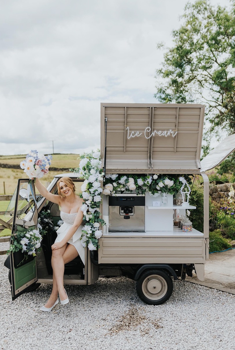 Guest in the driver's seat of the ice cream tuk-tuk